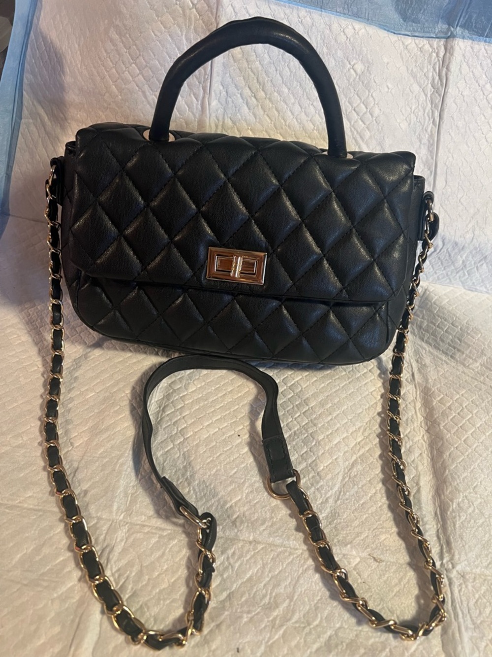 Quilted Black Top-Handle Shoulder Bag with Gold Chain Strap
